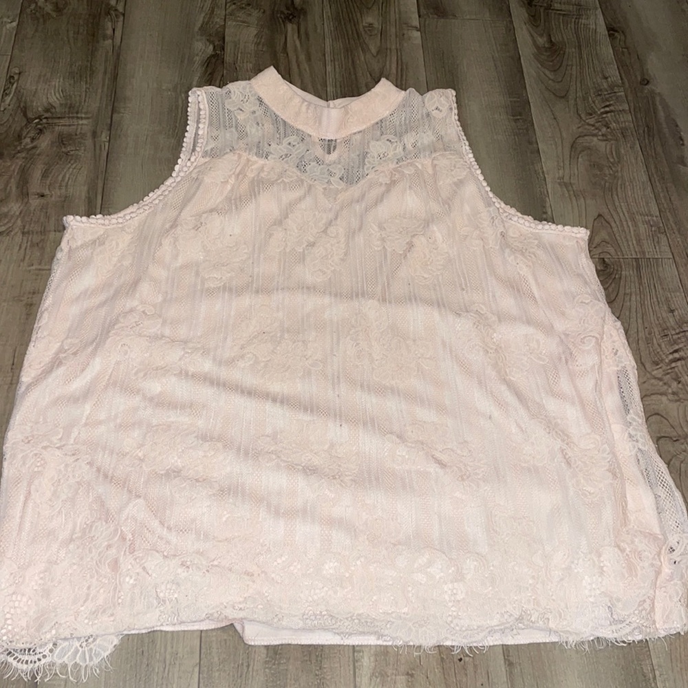 Not sure of the brand but it’s a light pink laced shirt
